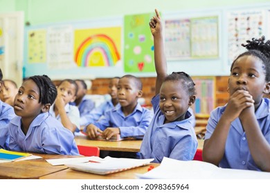 Student raising hand in class - Powered by Shutterstock