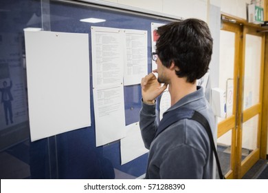 Student Reading Notice Board In College