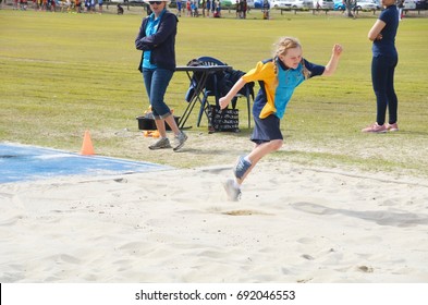 A Student From A School Doing A Long Jump At The Bramble Bay District Athletics,McPherson Park,Bracken Ridge,Brisbane,Australia ,Thursday 3rd Of August, 2017. Time Started From 8:30 Am To 12:30 Pm.   