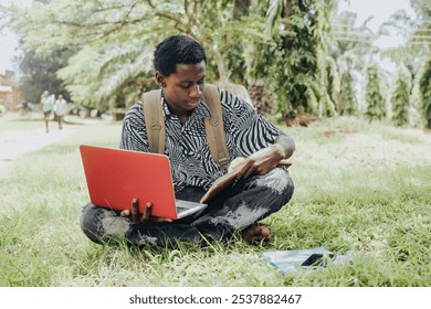 A student sitting on grass with a laptop and notebook, studying in a serene outdoor environment. The scene captures youthful focus, greenery, and a harmonious connection with nature. - Powered by Shutterstock