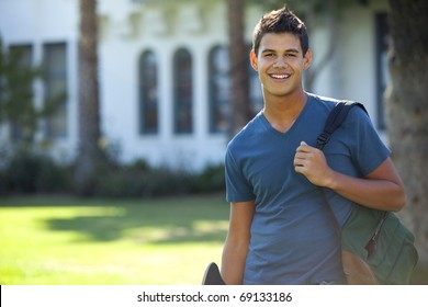 Student With Skateboard And Backpack Outside School