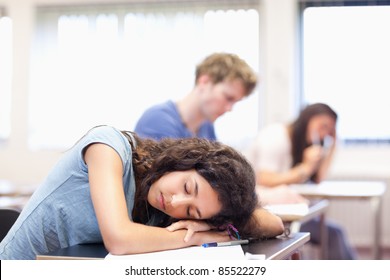 Student Sleeping On Her Desk In A Classroom