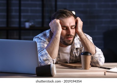Student sleeping at table late in evening - Shutterstock ID 2019194354
