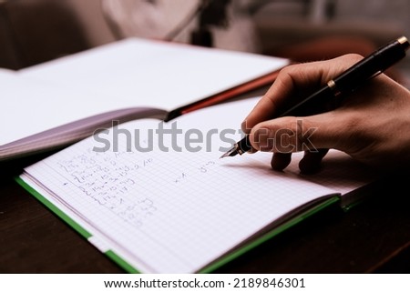 the student solves math problems. preparation for the math exam at home