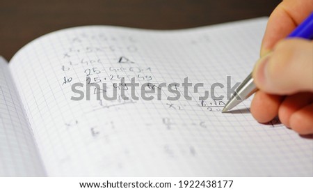 the student solves quadratic equations. High school graduation. Repeating for the exam. Counting the unknown side of a triangle