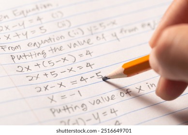 Student is solving algebra mathematic exercise test in college school