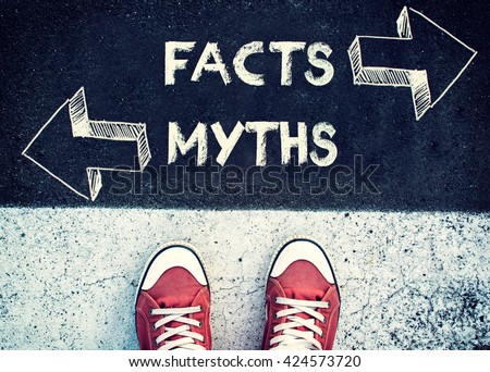 Student standing above the sign Facts and myths