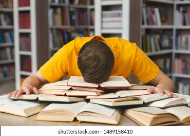 Student studying hard exam and sleeping on books in library, free space