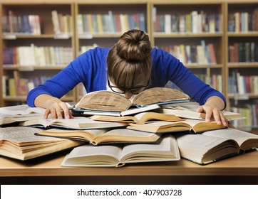 Student Studying Hard Exam and Sleeping on Books, Tired Girl Read Difficult Book in Library - Shutterstock ID 407903728
