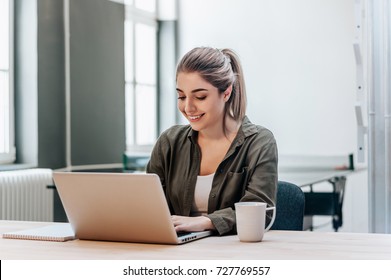 Student Studying And Learning Online With A Laptop In A Desk At Home.