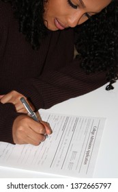 Student Submitting Her Application For College Admission.