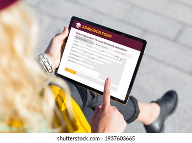Student Submitting Online Admission Form On Tablet Computer