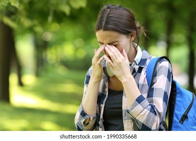 Student Suffering Allergy Symptoms Scratching Itchy Eyes In A Park Or Campus