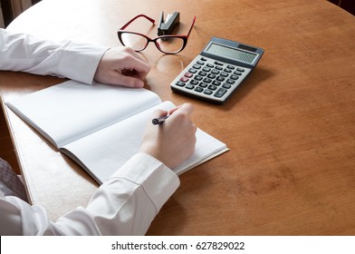 The student at the table does homework