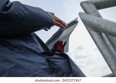 Student taking notes in the field