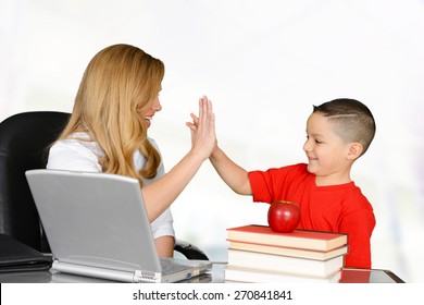 Student And Teacher High Five In Class