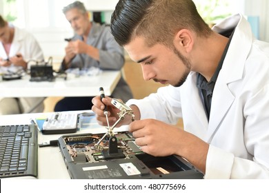 Student In Technology Fixing Computer Processing