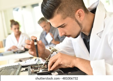 Student In Technology Fixing Computer Processing