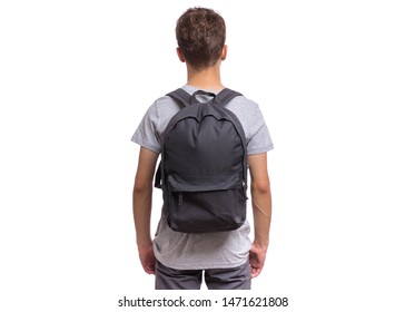 Student teen boy with backpack - back view. Portrait of cute schoolboy with hands in pockets, isolated on white background. Happy child Back to school - rear view.