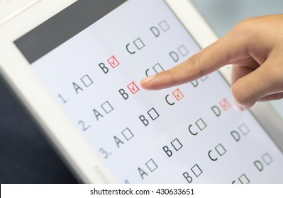 Student Testing Exercise, Exams Answer On Tablet With Multiple Choice Questions By Finger Clicking, Concept Educational Technology Use Physical Hardware, Computer-based, Online Learning Technologies