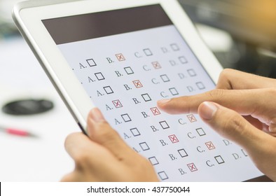 Student Testing Exercise, Exams Answer On Tablet With Multiple Choice Questions By Finger Clicking, Concept Educational Technology, Training Teachers To Use Computer Technology Improve Confidence.