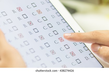 Student Testing Exercise, Exams Answer On Tablet With Multiple Choice Questions By Finger Clicking, Concept Educational Technology, Training Teachers To Use Computer Technology Improve Confidence.