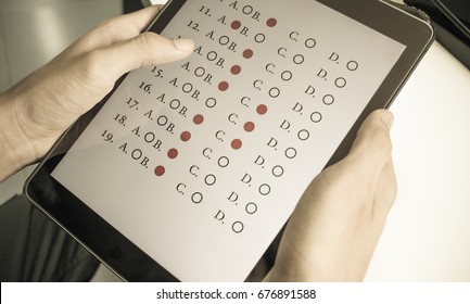 student testing exercise, exams answer on tablet with multiple choice questions by finger clicking, Concept Educational technology use physical hardware, computer-based, online learning technologies