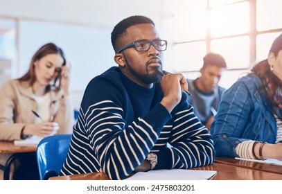 Student, thinking and man in university classroom for education, test or exam. Idea, college and studying in lecture for problem solving, doubt or brainstorming for learning knowledge at school - Powered by Shutterstock