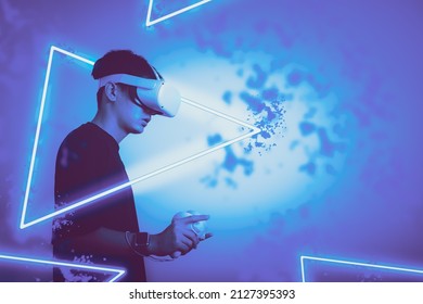 Student Use Vr Glasses And Looks At Empty Space With Gray Background, Studio Shot.Virtual Gadgets For Entertainment, Work, Free Time And Study. Game Cyber Virtual Reality Technology Concept.