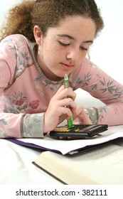 Student Using A Calculator To Do Math Homework.