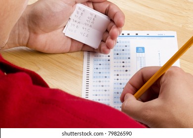 Student Using A Cheat Sheet To Cheat On His Test.