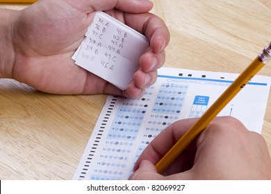 Student Using A Cheat Sheet To Cheat On His Test.