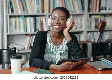 Student Using Digital Tablet In The Library - Powered by Shutterstock