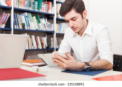 Student using his tablet computer - Powered by Shutterstock