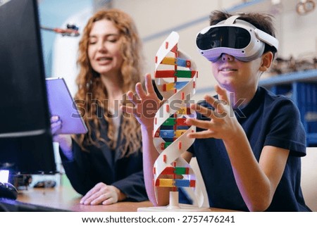 Student using vr headset exploring dna model with teacher in classroom, AI intelligence technology for children in school.