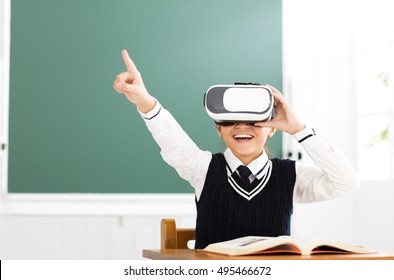 Student With Virtual Reality Headset Sitting In Classroom