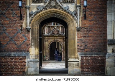 Student Walking Through The Gate In Cambridge