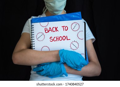 Student Wearing Face Mask And Gloves, Holding School Books. Concept Of Reopening Schools During COVID-19 Pandemic.