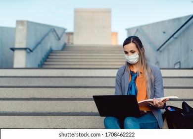 Student Woman Sitting On Empty Stairs Of University Campus Working