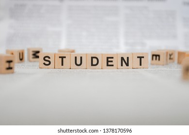 Student Word Written In Wooden Cube - Newspaper 