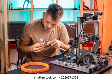 student in a workshop measures a detail printed on a 3D printer. High quality photo - Powered by Shutterstock