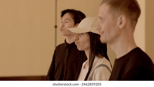 Students actors engage in articulation warm-ups before theatrical rehearsals. Exercises focus on enhancing vocal clarity, pronunciation, and diction delivered effectively and comprehensibly on stage. - Powered by Shutterstock