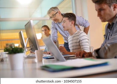 Students in apprenticeship attending computing class - Shutterstock ID 1034507155