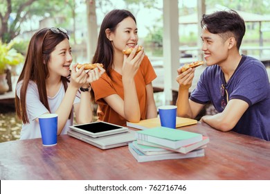 Students Asian Group Together Eating Pizza In Breaking Time Early Next Study Class Having Fun And Enjoy Party Italian Food Slice With Cheese Delicious At University Outdoor