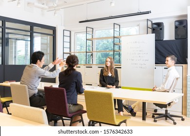 Students Asking Teachers Questions In An English Conversation Class