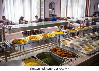 Students Being Served Meal In School Canteen. Lunch Break. Education People And Students Eating Food Meals School Cafeteria. Belgrade, Serbia 17.05.2022