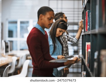 Students, books and search on shelf in library for reading, learning and education with university. People, check and choice with research, knowledge and resources for study or college scholarship - Powered by Shutterstock