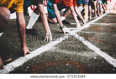 Students boy get set to leaving the starting for running competition boy at school sports day. School sports day concept. Stockfoto © 