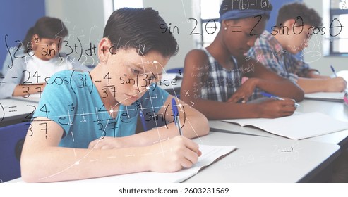 Students in classroom solving math problems, focusing on their work. Education, mathematics, studying, teamwork, concentration, problem-solving