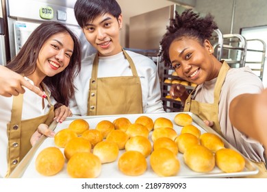 Students In Cookery Class Mixing Ingredients For Recipe In Kitchen.Group Of Young People Taking Selfie During Cooking Classes.